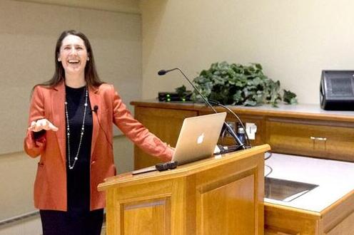 Woman standing at a podium