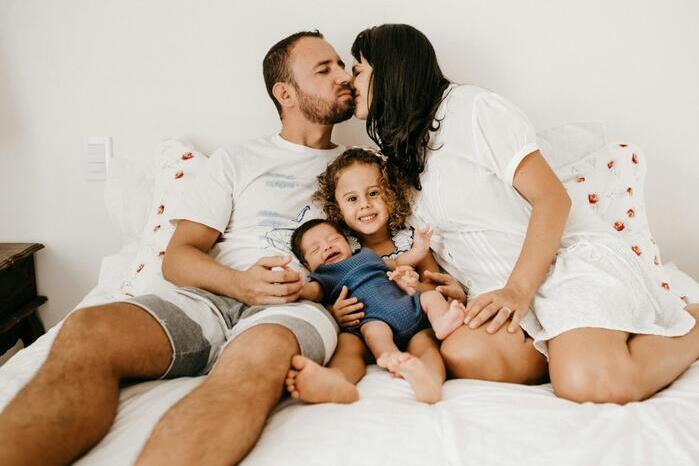 A family of four pose for a picture