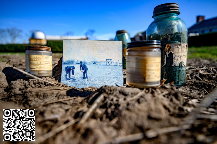 Several ancient-looking jars containing soil sit at ground level in the Morrow Plots, established in 1876. Among the jars is an 1860’s era photograph of Dr. Cyril Hopkins and an assistant, dressed in full suits and hats, sampling the Morrow Plots in 1904.