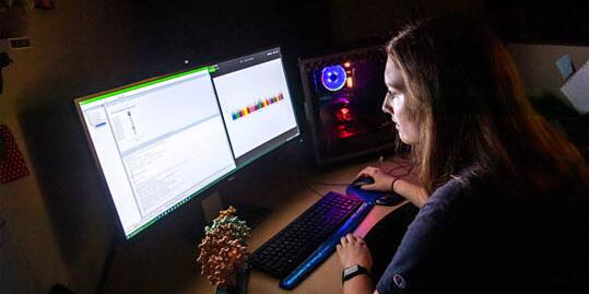 Student working on data on a computer
