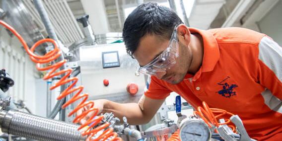 Student working with lab equipment