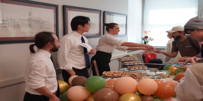 Students serving in a buffet line.